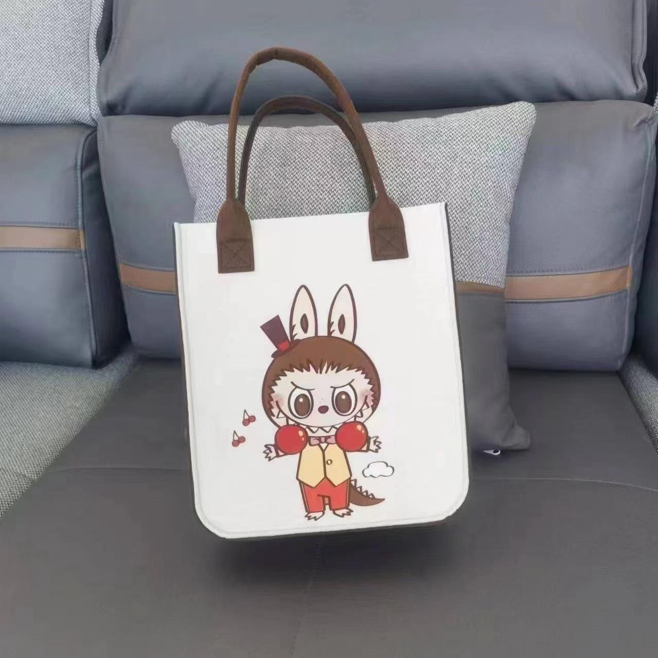 

New Labubu Felt Cartoon Printed Bag Handbag Felt Bag Accompanying Handbag Gift Student Work Shoulder Bag