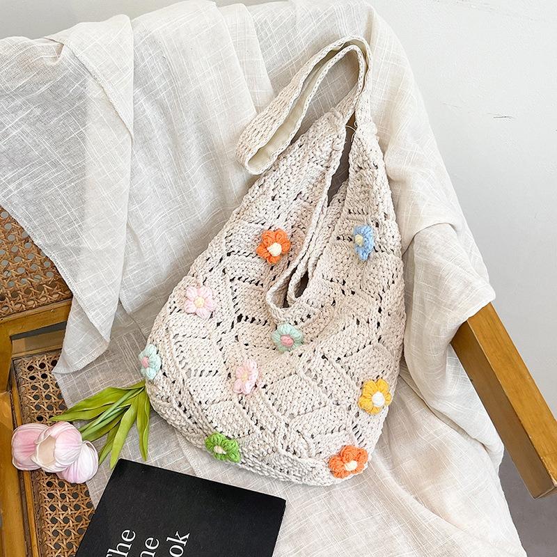 Beautiful flower hollow woven solid color tote bag, new large-capacity shoulder underarm bag, light and versatile bag
