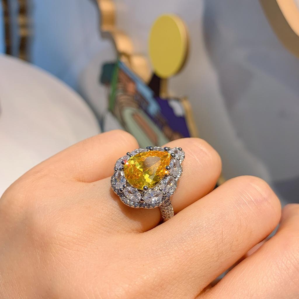 Wish European and American style retro simulation powder Huangbao water drop ring main stone 10 * 14