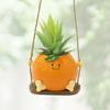Creative Multifunctional Orange Swing Planter Pot With Swing Feature Suitable for Kids Entertainment and Home Gardening