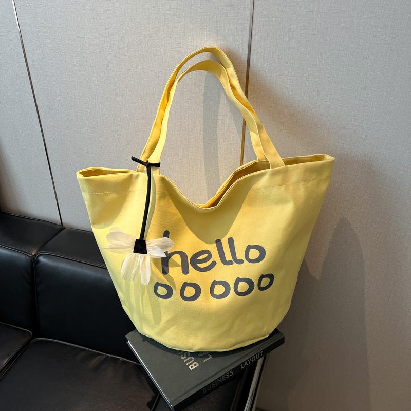 

Casual large-capacity canvas bag women s new simple student class shoulder commuter tote bag жовтий