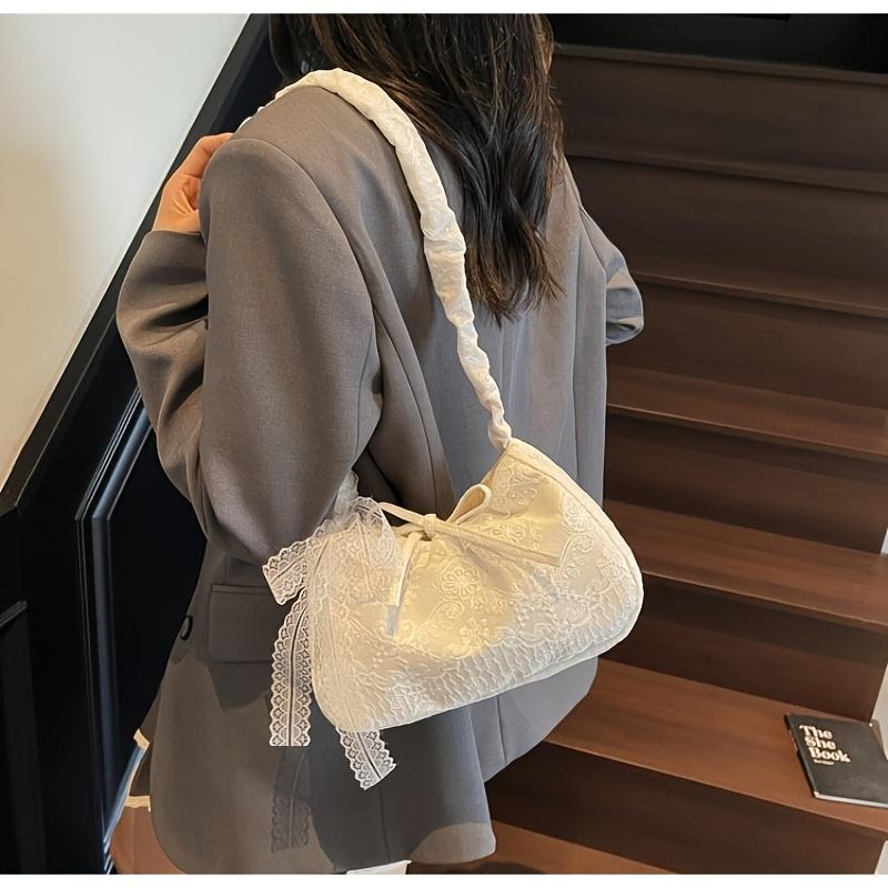 This lace armrest bag exudes a pure and alluring charm, while its sweet bow-tie design makes it perfect for women's dates, parties, and everyday