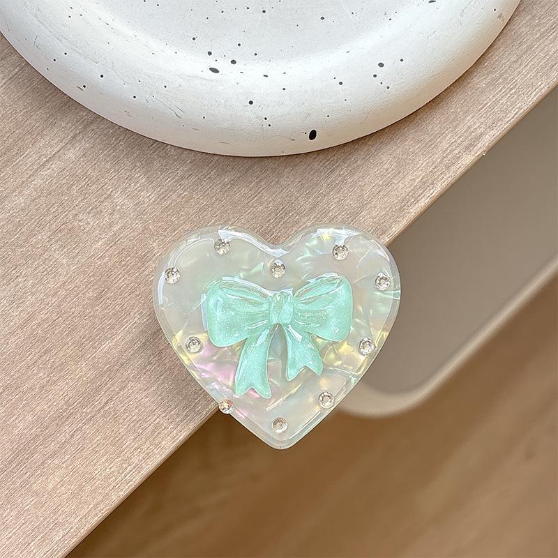 Colorful Heart Rhinestone Magnetic Phone Holder with Airbag, Folding Finger Ring, and Solid Color Bow - Korean & Japanese Style.