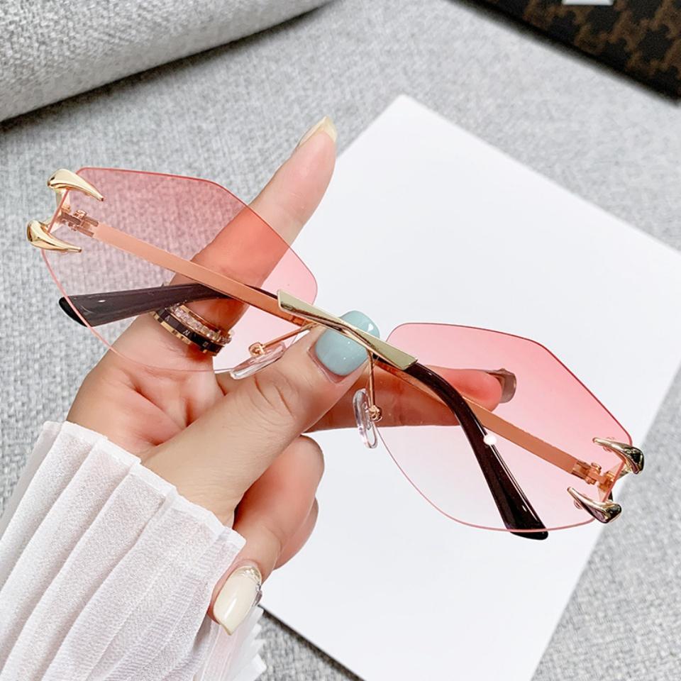 2026 Moda Nowe Damskie Okulary Przeciwsłoneczne UV400 Luksusowy Bezramkowy Design Kocie Oko Outdoor Rekreacja Wakacje Wysoka Jakość Damskie Okulary Przeciwsłoneczne