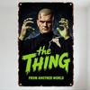 Vintage The Thing From Another World Metal Tin Sign, Shaved Head Man with Red Scar & Green Hands, Horror Neon Green Text Distres