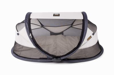 cream travel cot