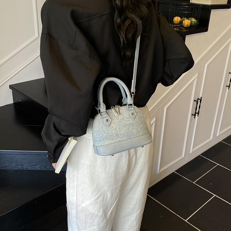 New niche design high-end versatile rivets portable fashionable single shoulder oblique span shell bag