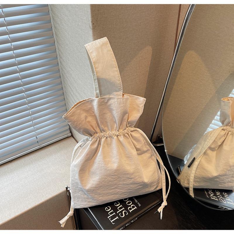 

Canvas bag women s large-capacity new autumn and winter niche pleated drawstring portable commuter bucket bag белый