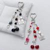 Modern Cherry Themed Keychain Accessory Crafted From Sturdy Materials Perfect For Adding Flair To Any Ensembles