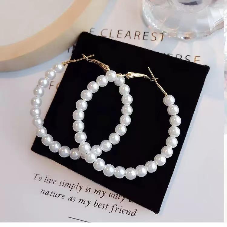 Korean fashion high-end earrings, simple design round earrings, creative light luxury cold wind temperament earrings