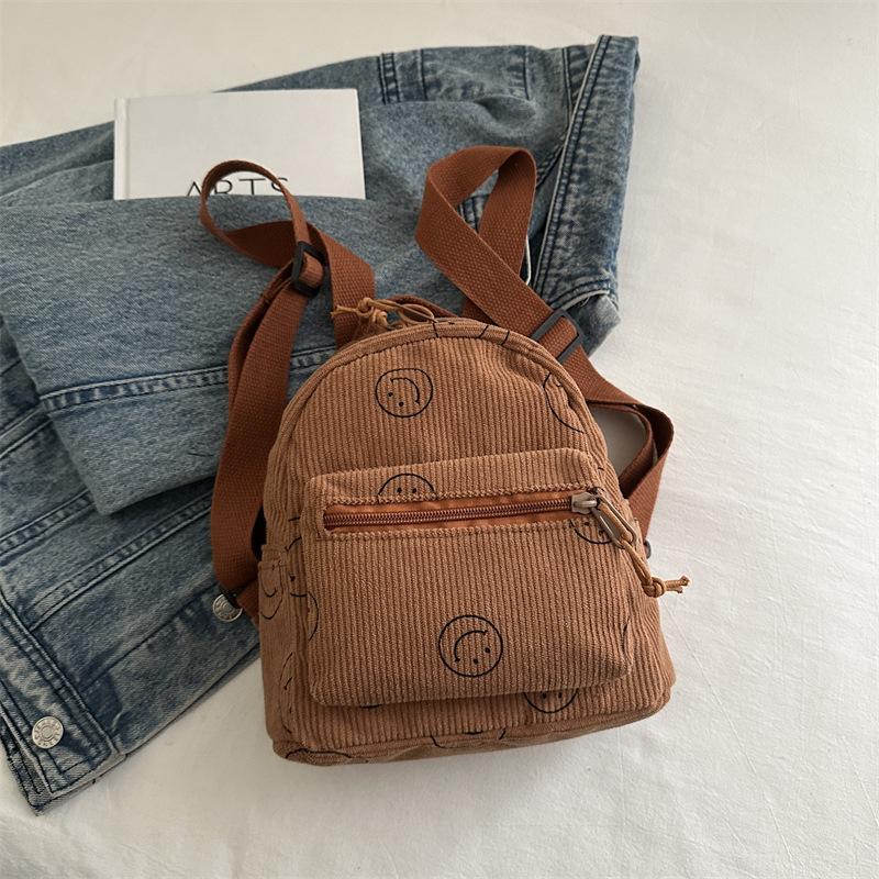 

Large capacity niche design simple retro smiley face backpack single shoulder crossbody multi-purpose student schoolbag women s 22.5*21.5*10cm темно-коричневого