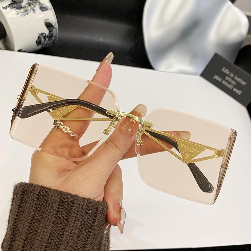 

New Frameless Edge Curved High-end Sense Women s Sunglasses Metal Inverted Triangle Decorative Glasses Men 90310