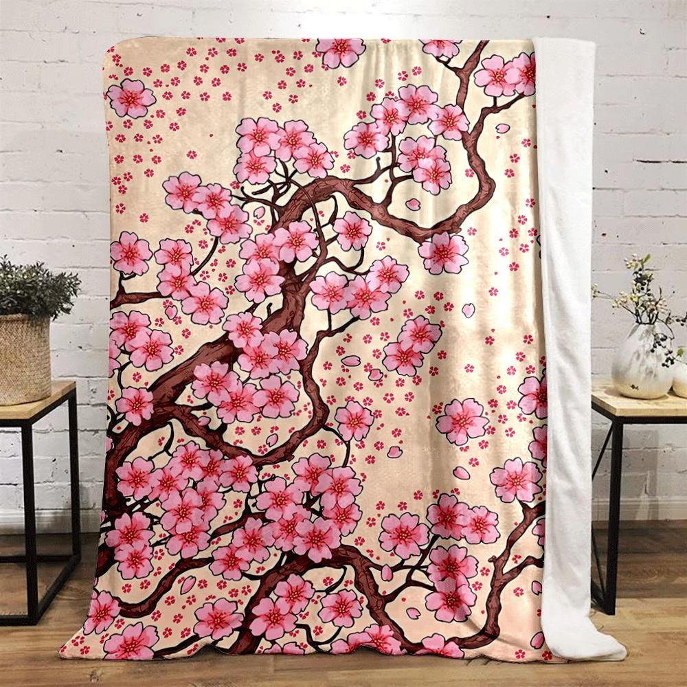Pink cherry blossoms with brown branches and scattered petals on beige. for all seasons blanket lunch break throw gift