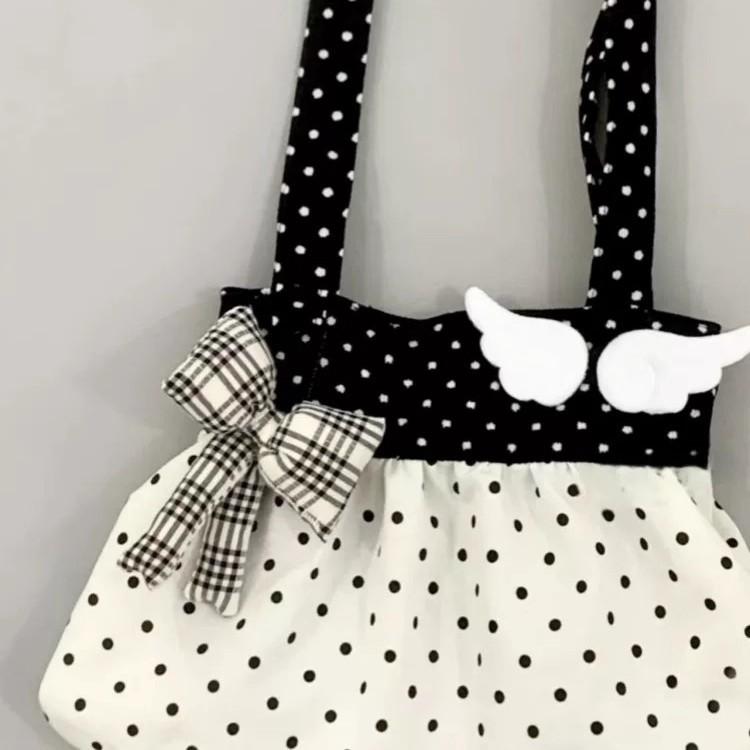 Niche design black and white polka dot canvas bag women's lazy style ancient commuting shoulder bag bow handbag