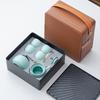 Portable Ceramic Kung Fu Tea Set: Teapot with Handle and Four Cups for Travel and Business Gifting