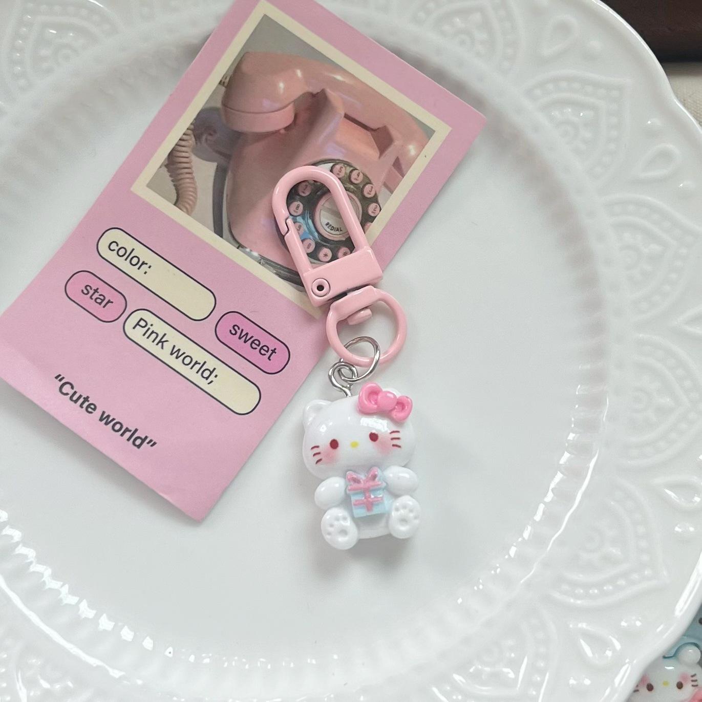 KT Cat Cartoon Backpack Keychain - Cute Pendant for Couples, Car Ornament, or Small Gift