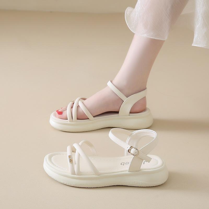 Stepping on shit feeling thick-soled Roman sandals female summer 2025 new fairy wind wear soft soles not tired feet beach shoes