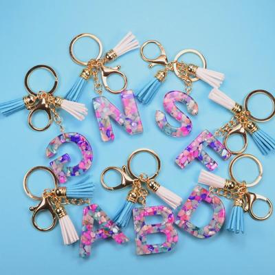 Schlüsselanhänger mit englischem Buchstaben und Quaste: Accessoires aus Harz und Acryl für Männer und Frauen – 26 einzigartige Buchstaben