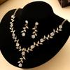 Popular Leaf and Flower Rhinestone Two-Piece Set Elegant dress paired with diamond-studded necklace and earrings for women
