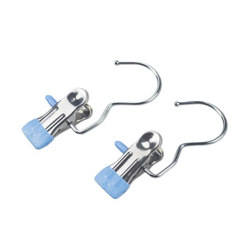 Clips de acero inoxidable multifuncionales para colgar ropa, bufandas y accesorios sin marcas.