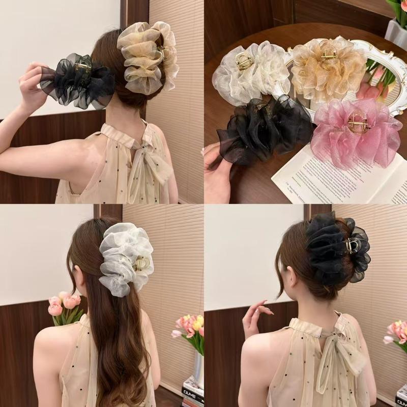 The Mesh Grabber Is Elegant and Feminine with A Lot of Hair On The Back of The Head. It Is A Shark Clip Hair Accessory