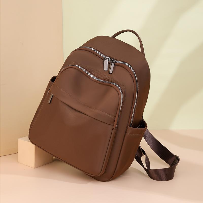 Simple and atmospheric backpack, durable travel, going out schoolbag, fashionable and versatile student 2025 new large-capacity bag