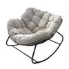 Rattan Rocking Chair: Comfortable Indoor/Outdoor Lounge with a Wrought Iron Frame.