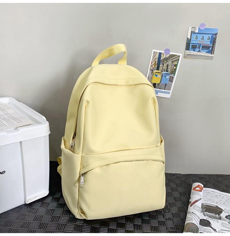 School bag 2025 new solid color simple backpack college student Korean version school bag versatile simple casual fashion backpack