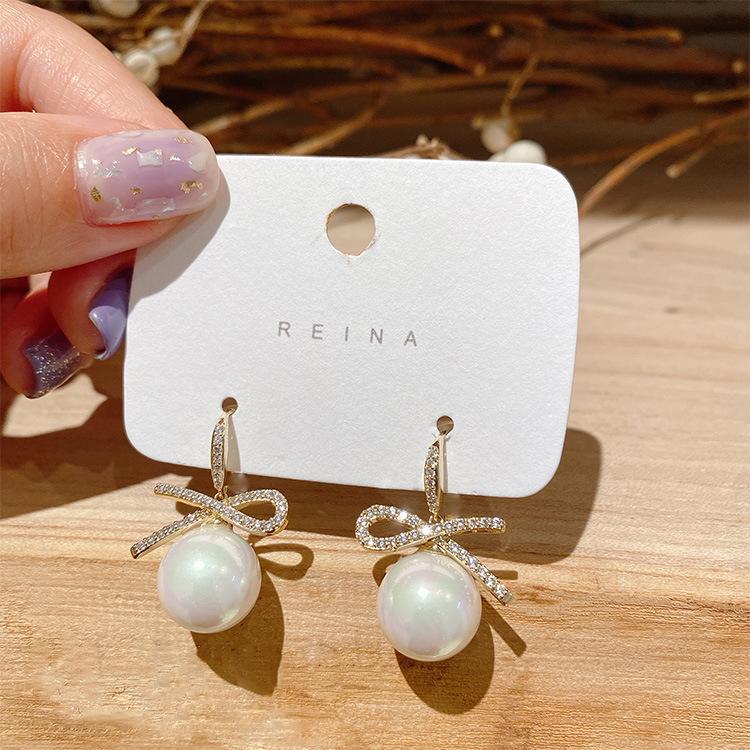 

Bowknot Pearl Earrings Trendy Fashion Versatile Earrings Copper Plated with Real Gold Sweet High-Gloss Pearl Dangle Earrings Jew