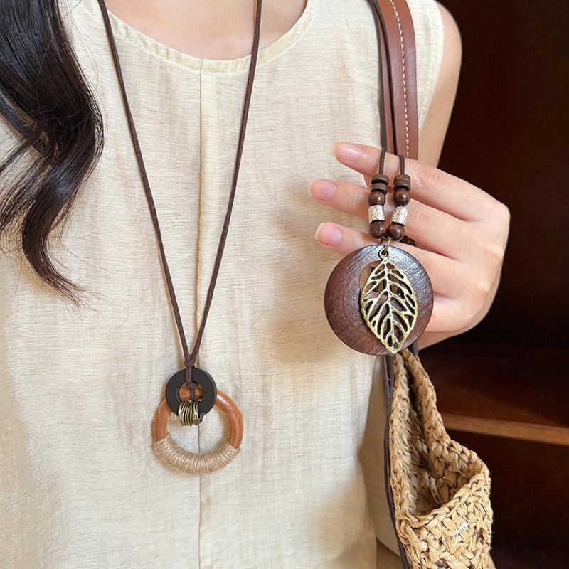 Bohemian wood beads beaded hollow round pendant necklace light luxury high-end sweater chain niche necklace accessories