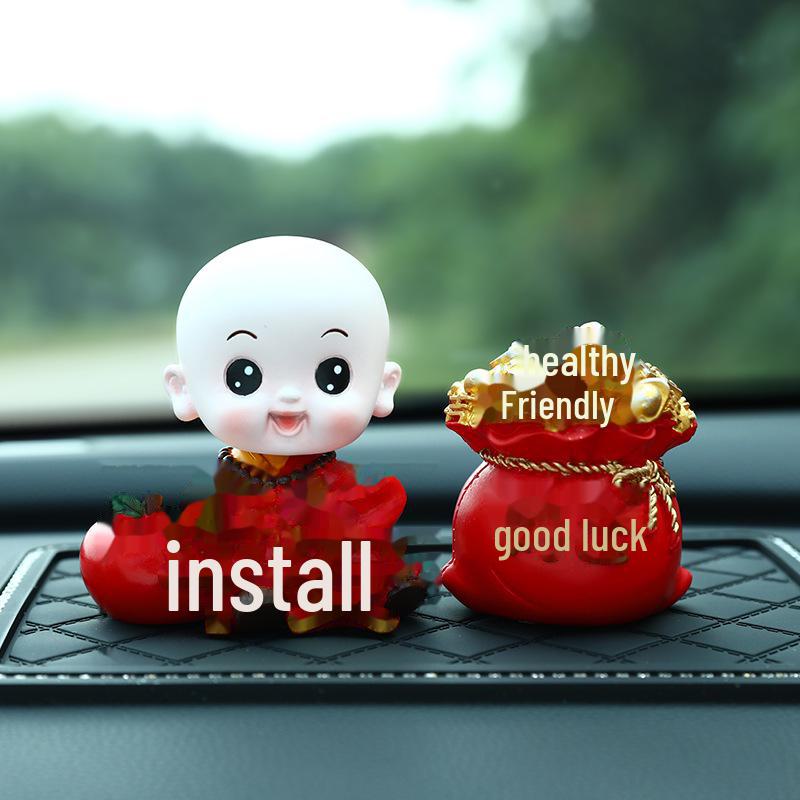 Creative Little Monk Maitreya Buddha Car Ornament: Cute, Shaking Head Resin Doll for Car Interior Decoration and Safety.