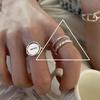 Dongdaemuns minimalistiske vridningsring og zirkonarmbåndssett for kvinner