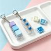 Sleutelhanger voor stressverlichting: Decompressie Kubus met Vier Knoppen & Toetsenbord Hanger