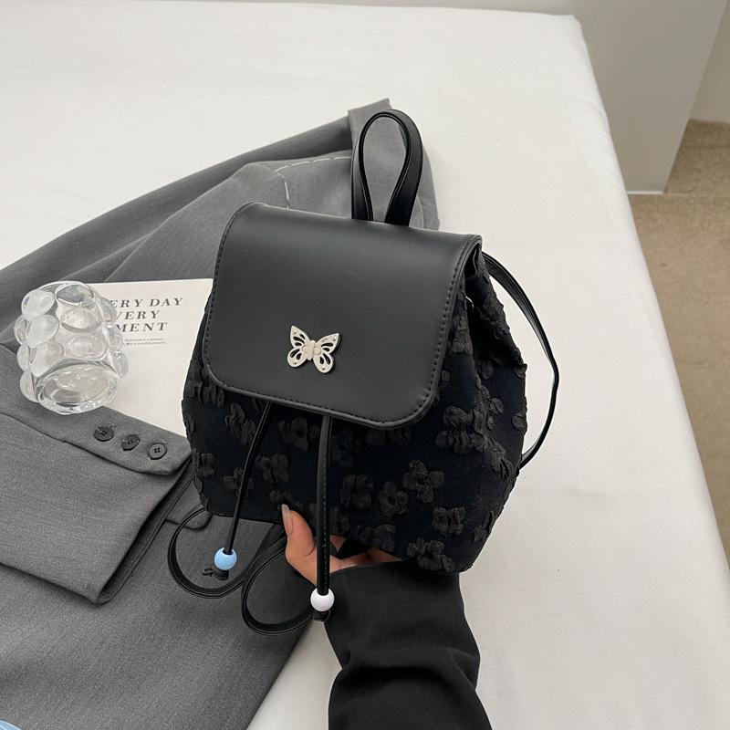 

Модний жіночий рюкзак із квітковим орнаментом чорний