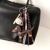 Vintage-Schlüsselanhänger aus PU-Leder mit Dackel, süßer Hundewelpen-Charme, geflochtenes Seil, Taschenanhänger für Autoschlüssel-Zubehör