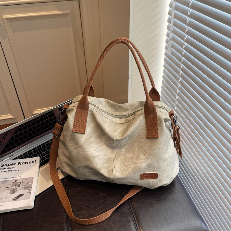 Fashion large-capacity travel bag contrasting colors 2025 casual retro canvas versatile messenger bag shoulder bag handbag