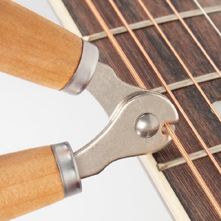 Compact All in One Guitar Tool with String Winding System and Bridge Pin Remover for Musicians and Repair Technicians