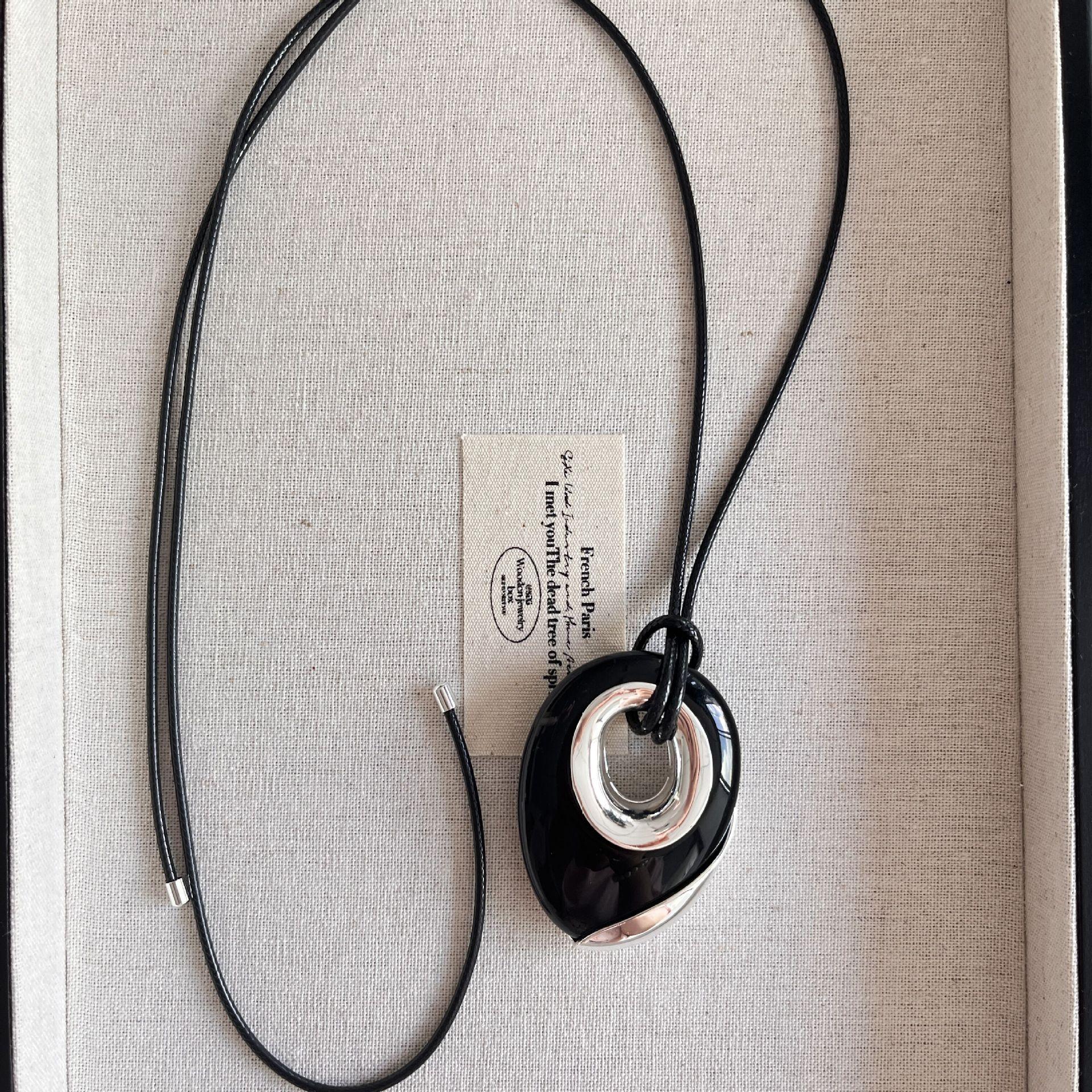 

Тяжелая промышленность обсидиан геометрический кулон ожерелье женская ниша легкий роскошный высококачественный кожаный канат длинный модный свитер цепь