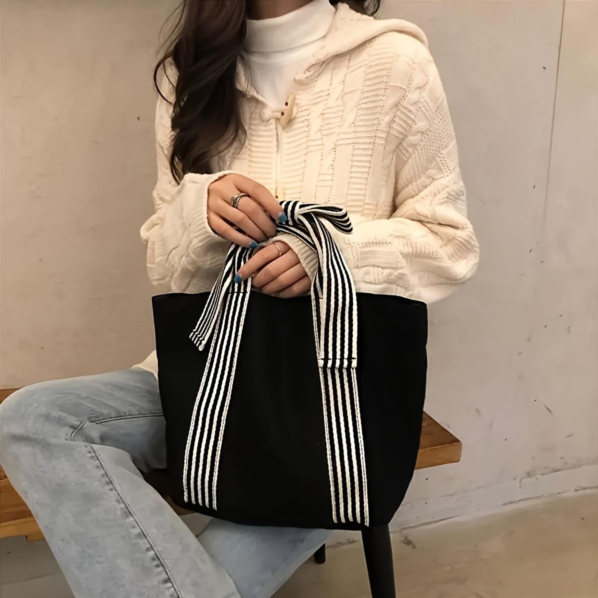 

Black neutral fashi simple women s bow canvas bag hand pull dark tie small fresh hand handbag a bag чёрный