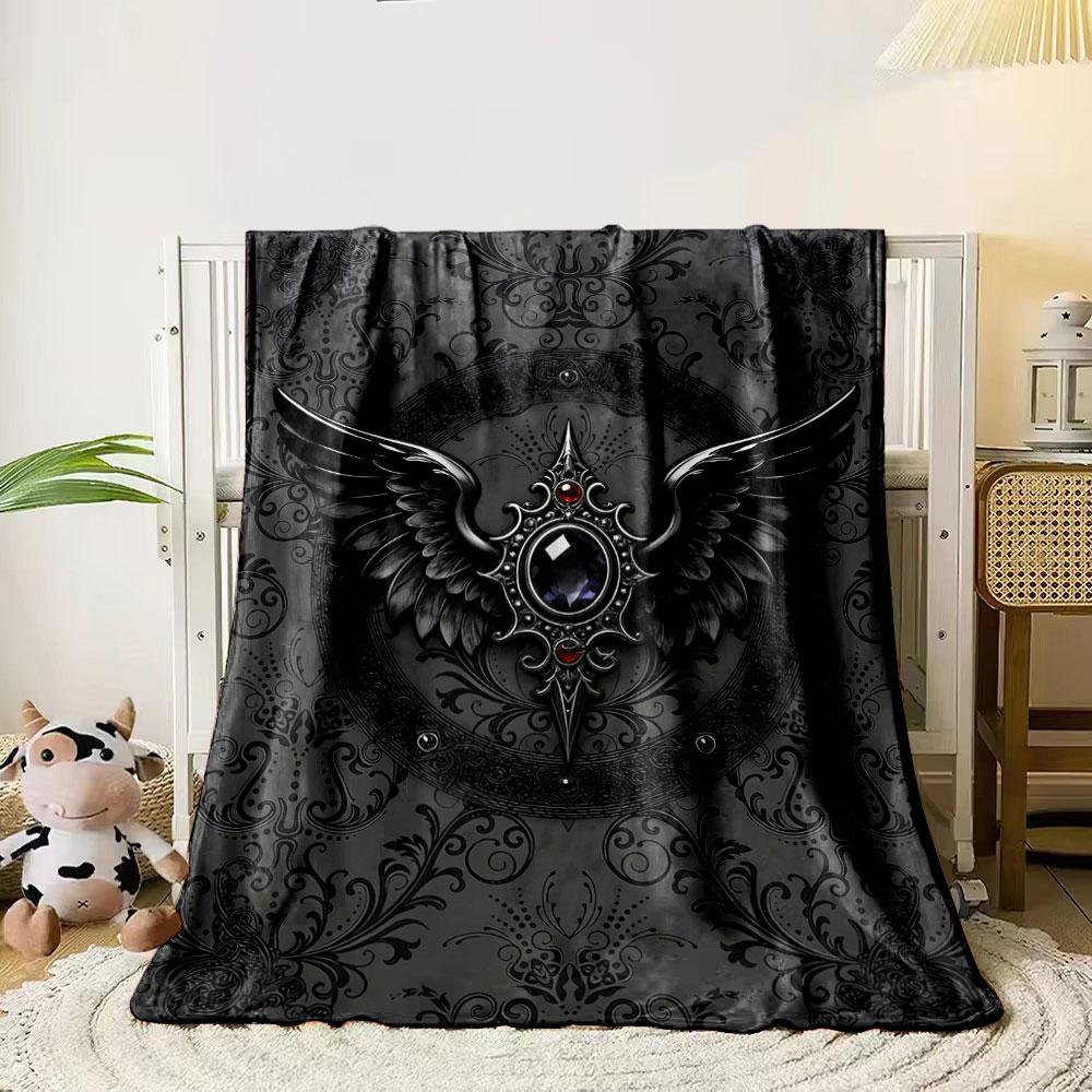 

Intricate black winged emblem with a central jeweled design on ornate background. for all seasons blanket lunch break throw gift 80cm x 120cm
