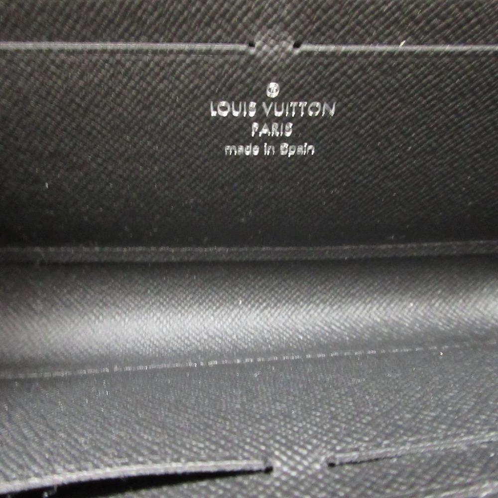 Used AUTHENTIC LOUIS VUITTON M69409 L-shaped fastener Taiga Zippy Dragonnes wallet