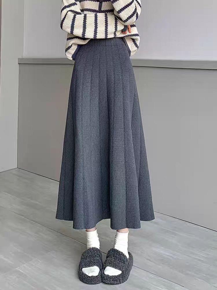 European, American autumn and winter new solid color elastic waist design sense texture medium and long versatile skirt foreign style knitted skirt