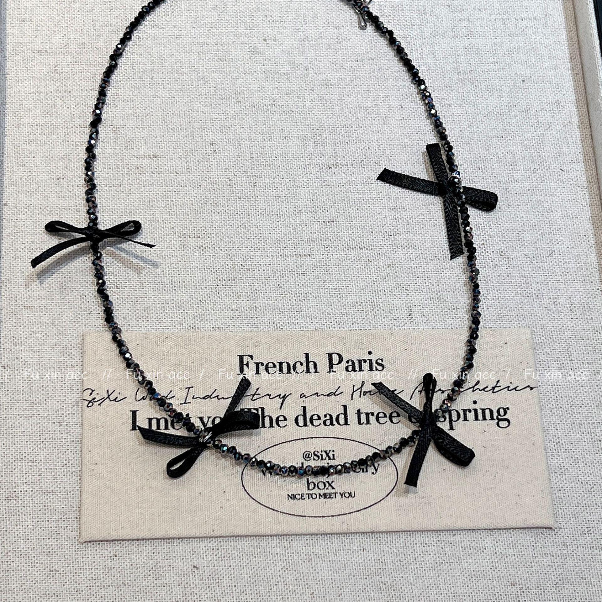 

Изысканное нежное ожерелье из хрустальных бусин с бантом из ленты - легкий роскошный стиль