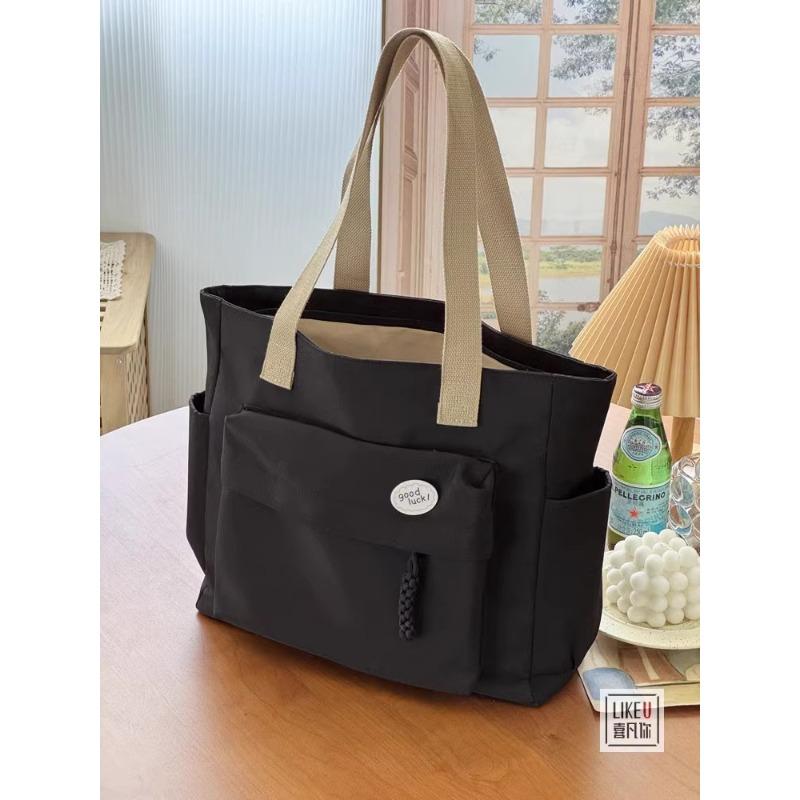 

Original design Japanese rope knot commuter thickened nylon tote bag leisure art student simple shoulder handbag чорний