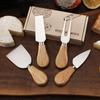 Käsemesser-Set aus Edelstahl mit Griff aus Gummibaumholz: Enthält Messer, Gabel, Pfannenwender und Buttercrememesser.
