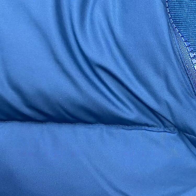 Nike Kurtki puchowe Męskie Niebieskie Stójka Średnia Kurtka puchowa IB4499-415