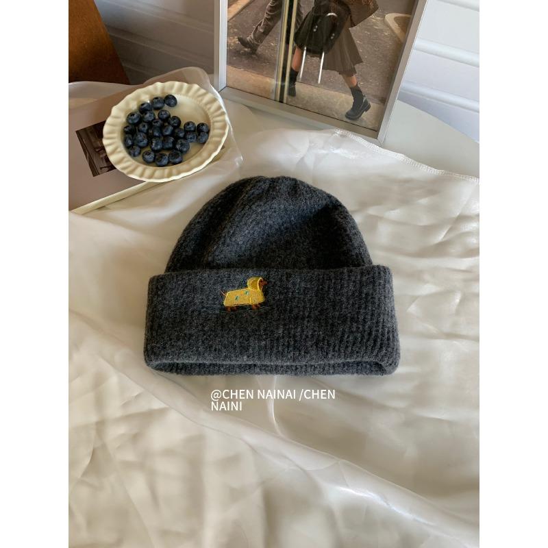 Embroidered Woolen Caps Are Cute for Children In Autumn and Winter. They Are Small Knitted Caps with Big Heads That Show Off Their Faces