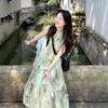 New Chinese women's sleeveless neck-hanging dress, cold and relaxed in early spring, wear a suspender green floral dress