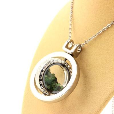 Stones and Minerals. Raw Tsavorite Garnet Necklace. Spherical Hourglass Model.