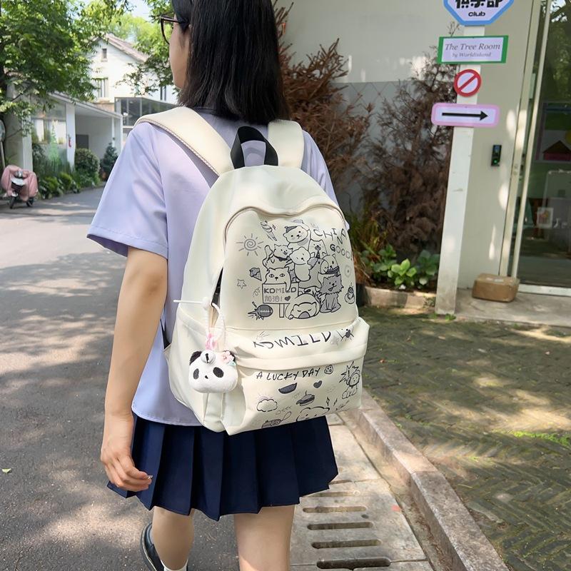 Cute graffiti school bag girl junior high school student large capacity computer travel backpack female college student small fragrance backpack .